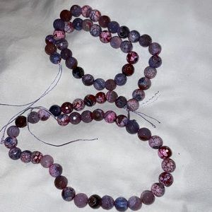 2 strings of pink marbled beads